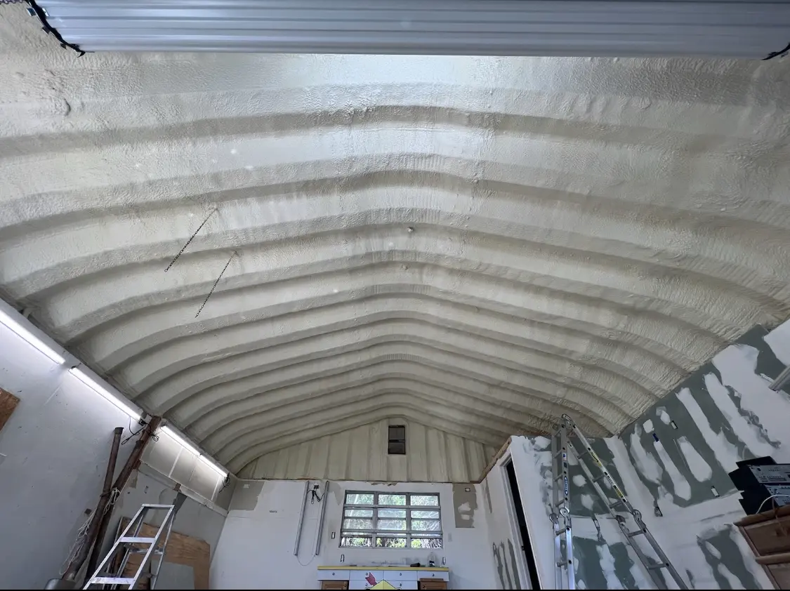 Spray polyurethane foam applied to the underside of a metal roof deck in Waterloo